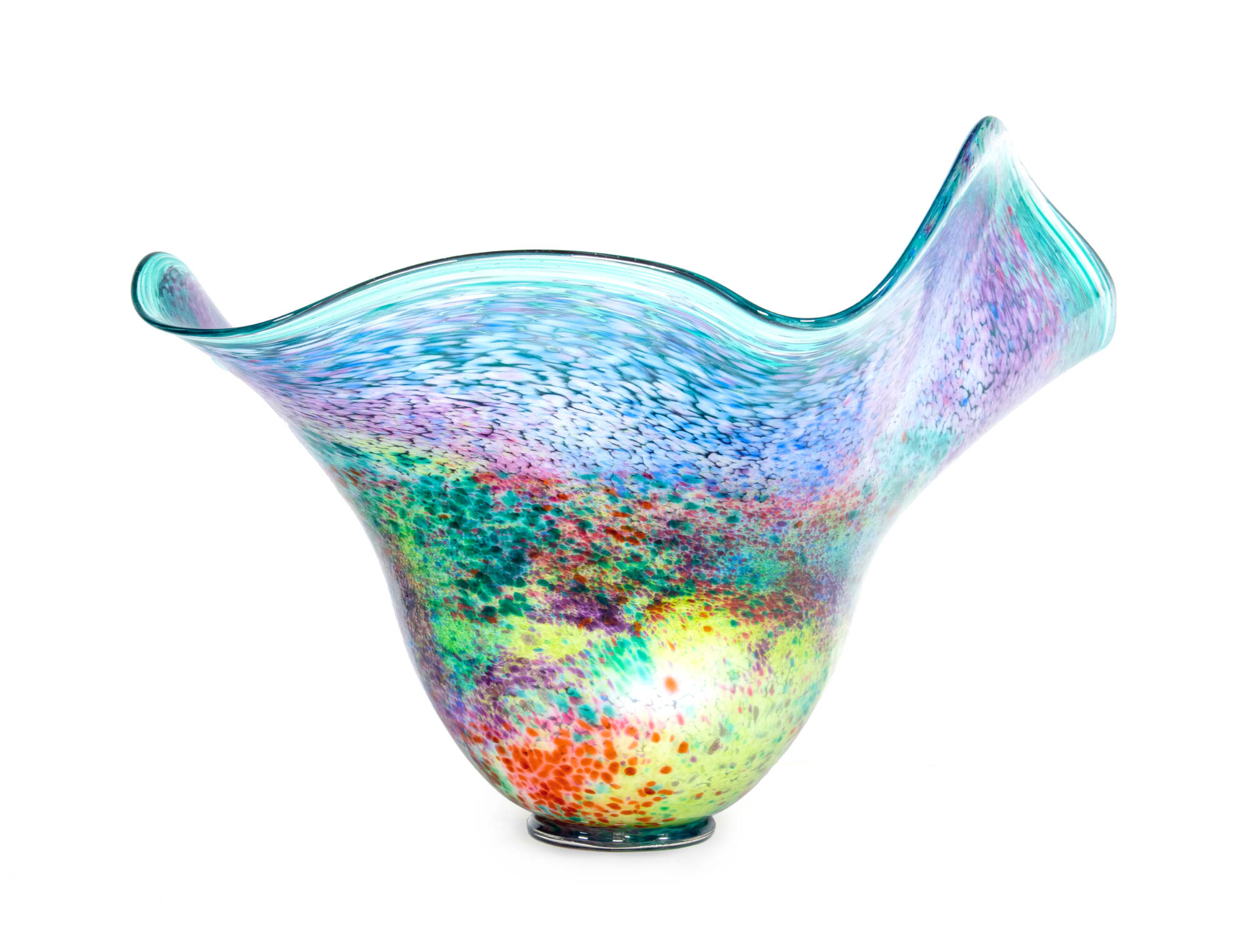 Tall glass vase with wide curvy top edge. Brightly colored with speckles of color in the glass, shades of blue, green, yellow, purple and red.